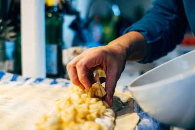 Midsection of man preparing food