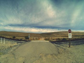 Empty road against sky