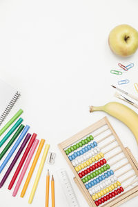 Close-up of multi colored objects on white background