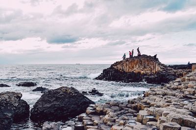 Scenic view of sea against cloudy sky