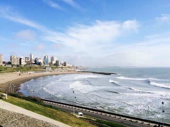 Panoramic view of beach and buildings against sky