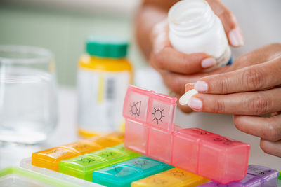 Cropped hand holding bottle