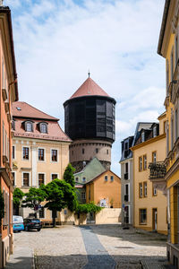 Buildings in city against sky