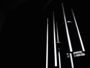 Close-up of metal grate against black background