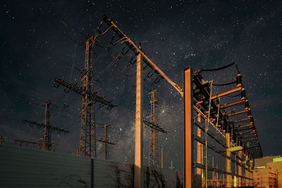 Low angle view of a electric construction against sky at night