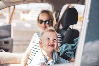 Portrait of woman sitting in car