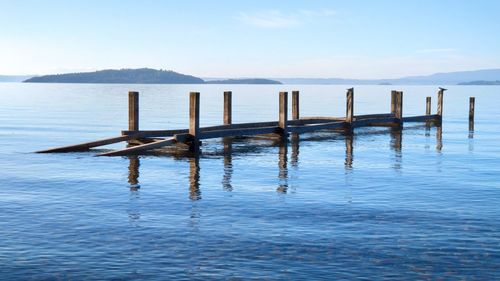 Old wooden dock in the very calm lake