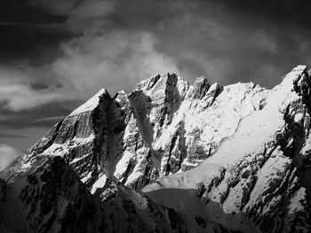 Scenic view of snowcapped mountains against sky.