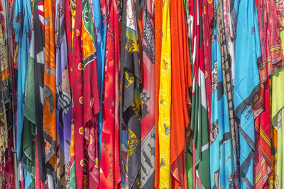 Full frame shot of multi colored flags hanging at market