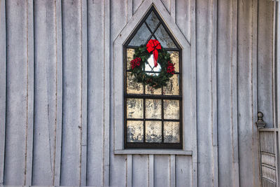 A church window with a christmas wreath