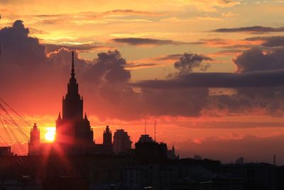 Silhouette of city during sunset