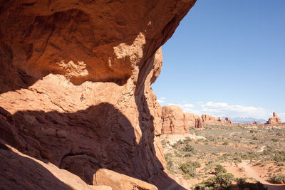 Rock formations on landscape against sky