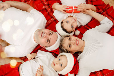 Happy family on christmas eve. cozy time at home. togetherness concept