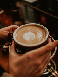 Close-up of coffee cup on table