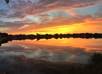 Scenic view of lake at sunset