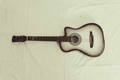 Close-up of guitar against white background