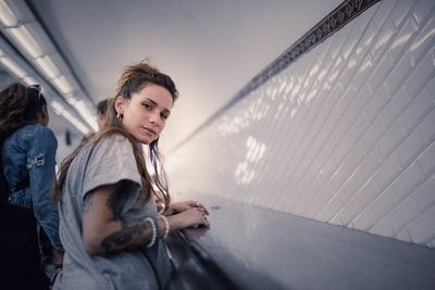 Portrait of woman on escalator