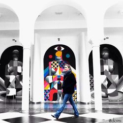 Rear view of girl standing in shopping mall