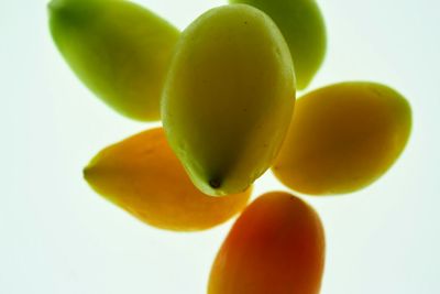 Close-up of fruit against white background