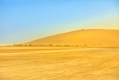 Scenic view of desert against clear sky