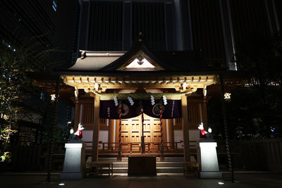 Low angle view of illuminated building at night