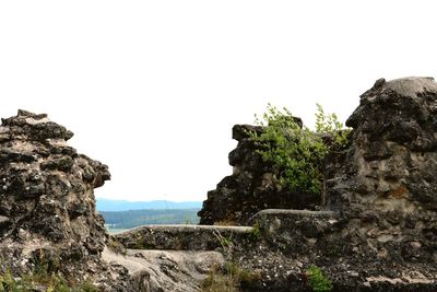 Low angle view of rock formation against clear sky