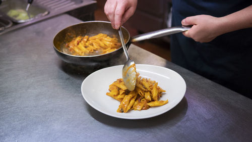 Preparation of garganelli dish, italy.