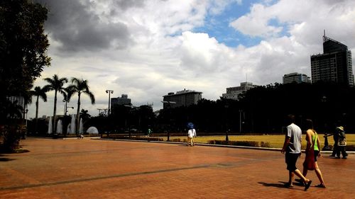 City street against cloudy sky