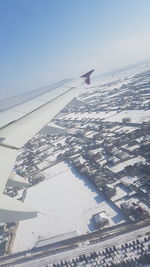 Aerial view of landscape against clear sky during winter