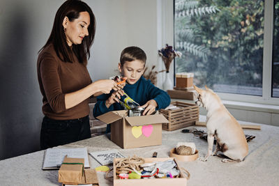 Charity care pet box, donation box, gift package for pet shelter. happy family, mother, kid and dog