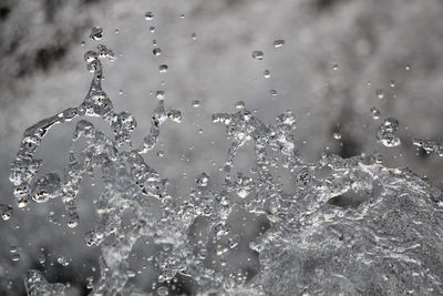 Full frame shot of raindrops on water