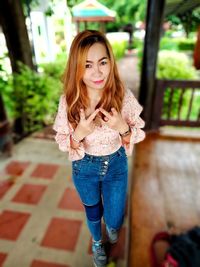 Portrait of beautiful woman standing outdoors