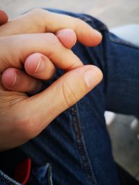 Close-up of man holding hands