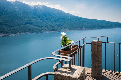 Scenic view of sea and mountains against sky