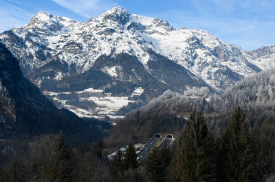 Scenic view of snowcapped mountains against sky