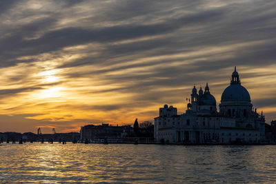 View of buildings against sky during sunset