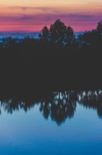 Scenic view of lake at sunset