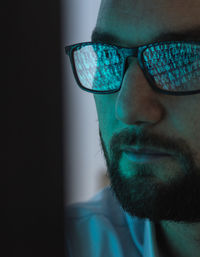 Reflection of binary codes on hacker's eyeglasses