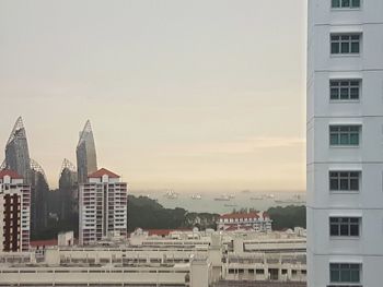 Cityscape against sky during sunset