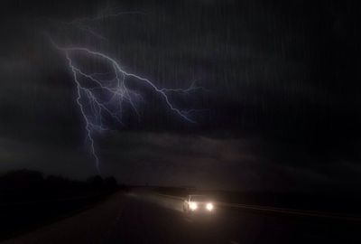 Illuminated road at night