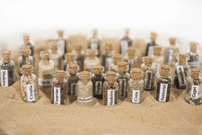 High angle view of bottles against white background