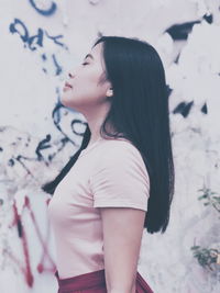 Close-up of young woman standing outdoors