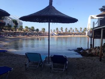 Deck chairs and tables at seaside