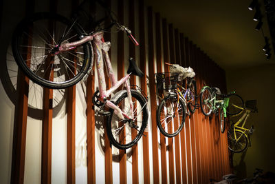 Low angle view of bicycles on wall