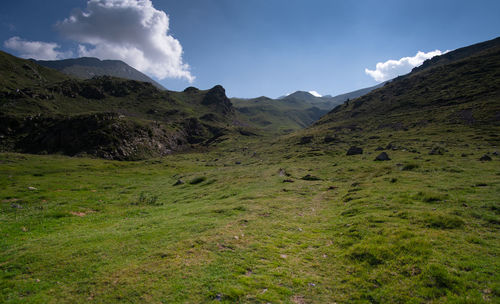 Scenic view of landscape and mountains against sky