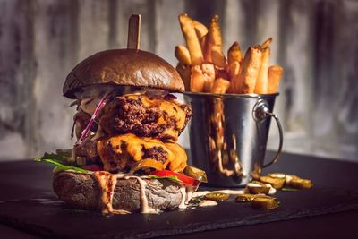 Close-up of burger and french fries on table