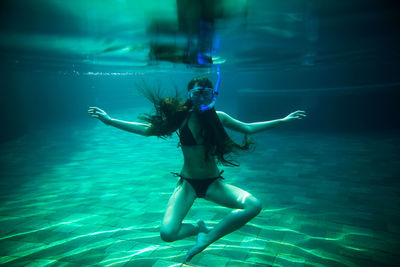 Woman swimming in sea