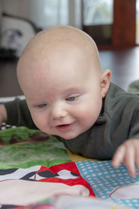 Close-up of cute baby on bed