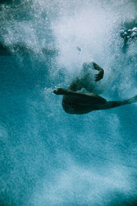 Dancer swimming in pool