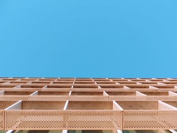 Low angle view of building against clear blue sky